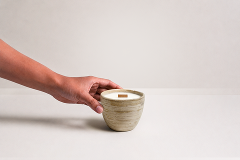 Ishi Candle with hand reaching toward vessel