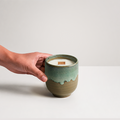 Mizuki Candle with hand reaching toward vessel