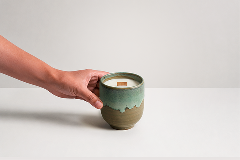 Mizuki Candle with hand reaching toward vessel